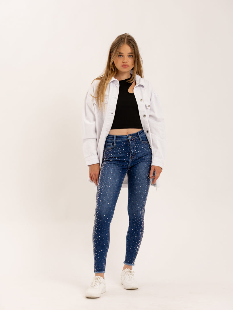 Jean skinny orné de cristaux ourlet effiloché